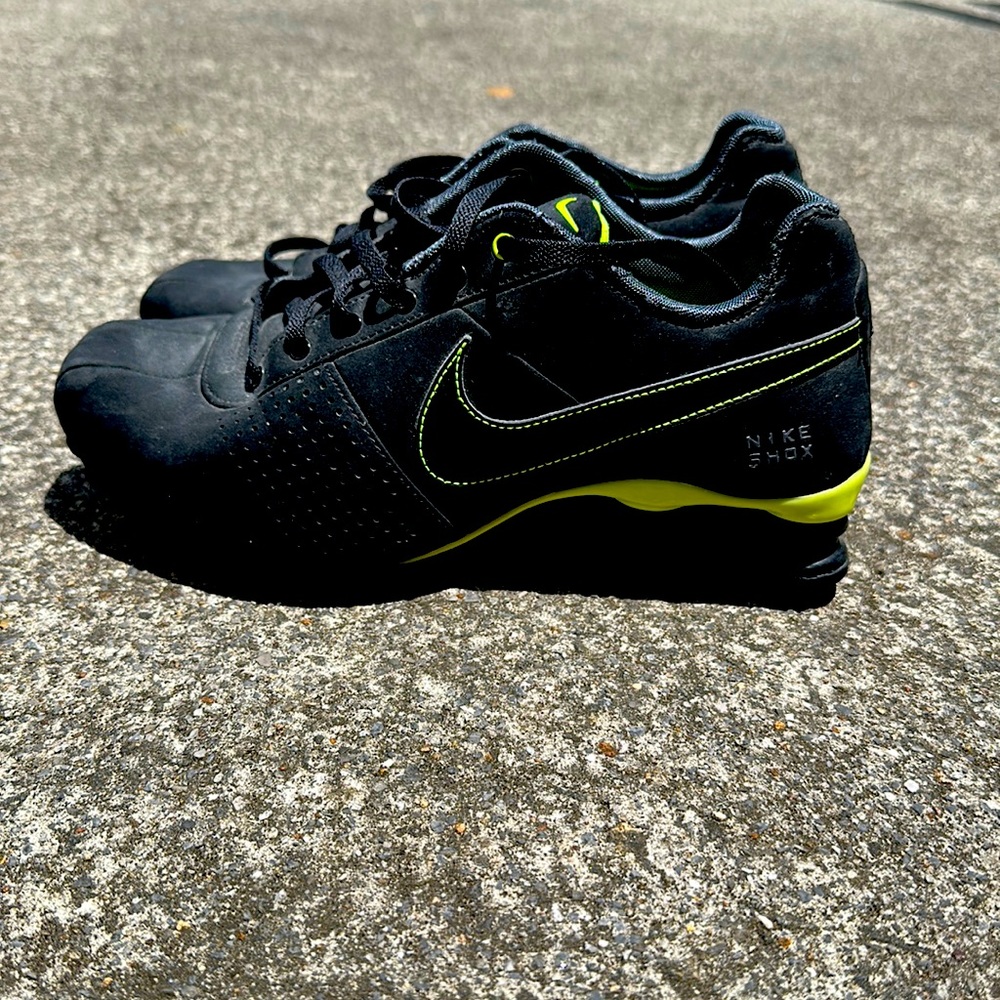 Black and neon green Nike Shox